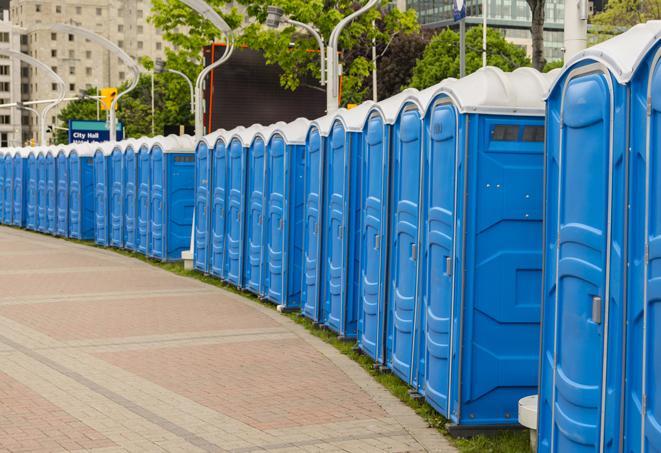 colorful portable restrooms available for rent at a local fair or carnival in Arabi